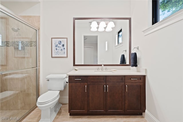 4249 Deephaven Ln, Naples, FL 34119 - bathroom with toilet, a stall shower, vanity, and baseboards