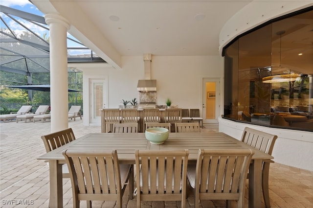 4249 Deephaven Ln, Naples, FL 34119 - dining area featuring brick floors and a sunroom