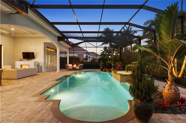 4249 Deephaven Ln, Naples, FL 34119 - swimming pool featuring a patio area, french doors, an outdoor hangout area, and glass enclosure