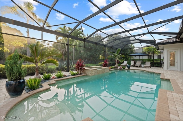 4249 Deephaven Ln, Naples, FL 34119 - view of swimming pool featuring a patio, glass enclosure, and a pool with connected hot tub