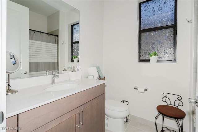 5633 Cassidy Ln, Ave Maria, FL 34142 - bathroom featuring tile patterned floors, vanity, and toilet