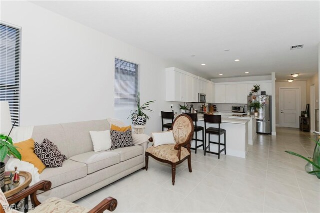 5633 Cassidy Ln, Ave Maria, FL 34142 - living area with light tile patterned floors and recessed lighting