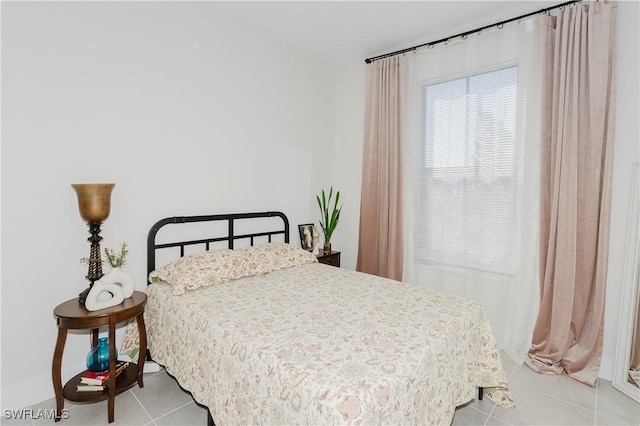 5633 Cassidy Ln, Ave Maria, FL 34142 - bedroom with light tile patterned flooring