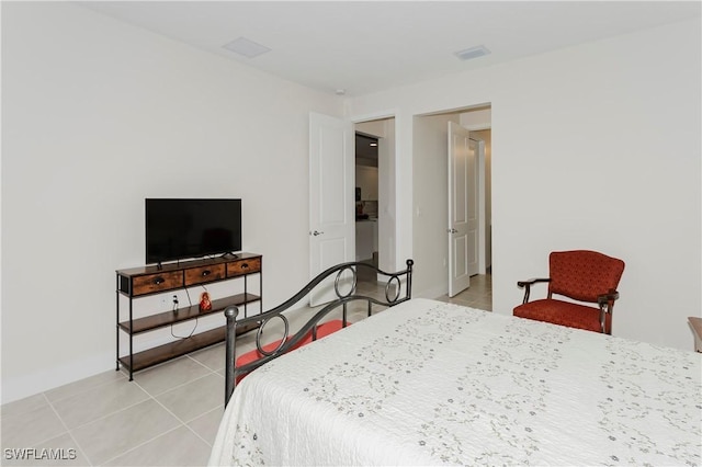 5633 Cassidy Ln, Ave Maria, FL 34142 - bedroom featuring light tile patterned flooring and baseboards