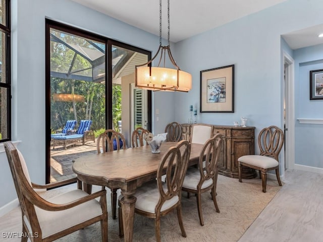 811 Manor Ter, Marco Island, FL 34145 - dining space with baseboards and a sunroom