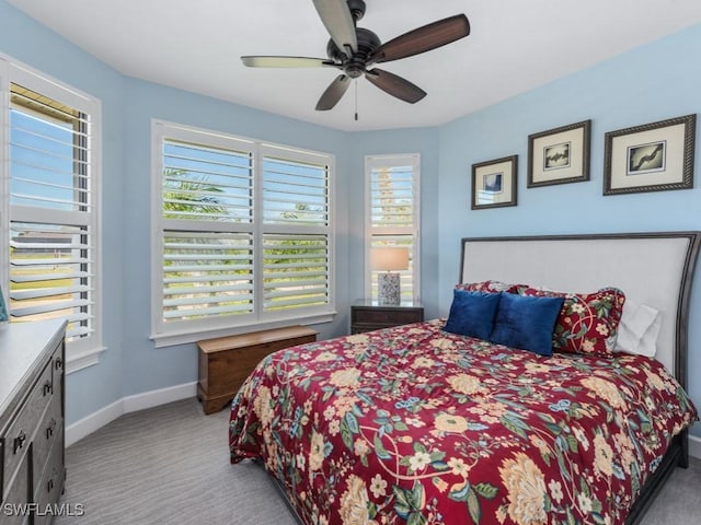 811 Manor Ter, Marco Island, FL 34145 - bedroom with carpet flooring, baseboards, and multiple windows