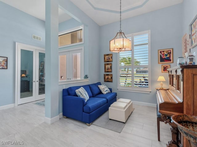 811 Manor Ter, Marco Island, FL 34145 - living area with french doors and baseboards