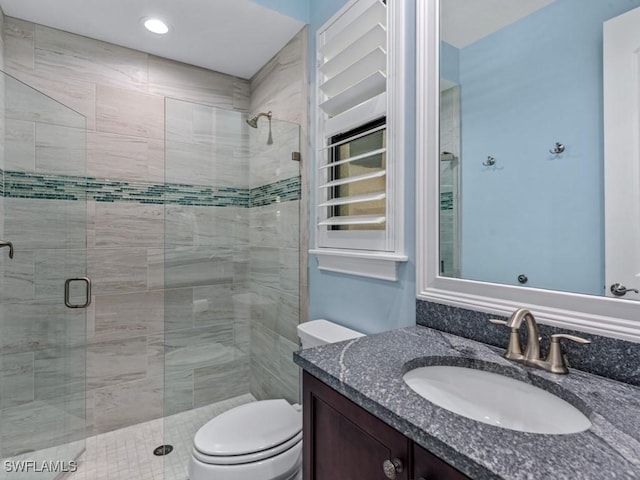 811 Manor Ter, Marco Island, FL 34145 - full bathroom featuring toilet, a stall shower, and vanity