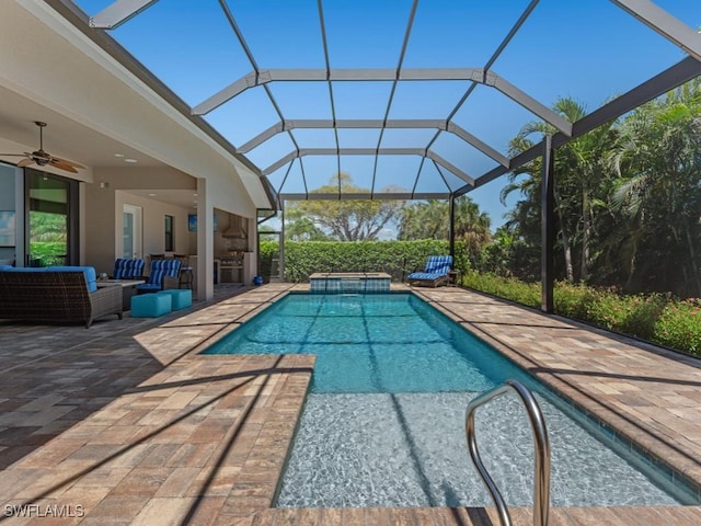 811 Manor Ter, Marco Island, FL 34145 - view of pool featuring a ceiling fan, a patio area, outdoor lounge area, glass enclosure, and a pool with connected hot tub