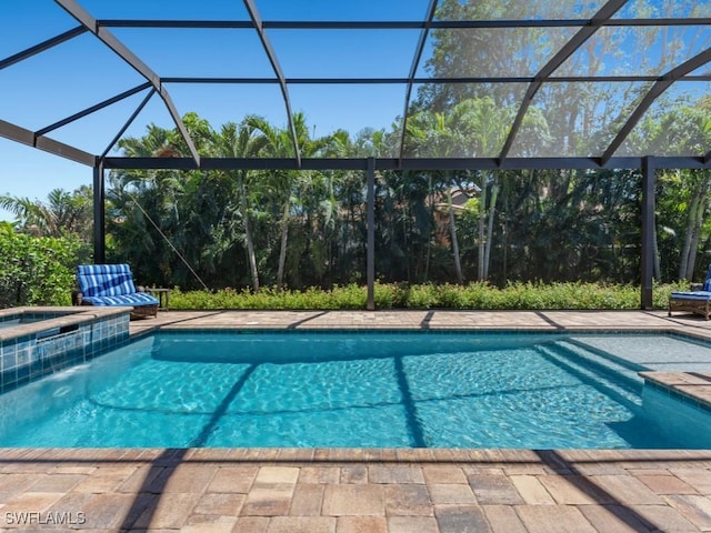 811 Manor Ter, Marco Island, FL 34145 - swimming pool with an in-ground hot tub, glass enclosure, and a patio