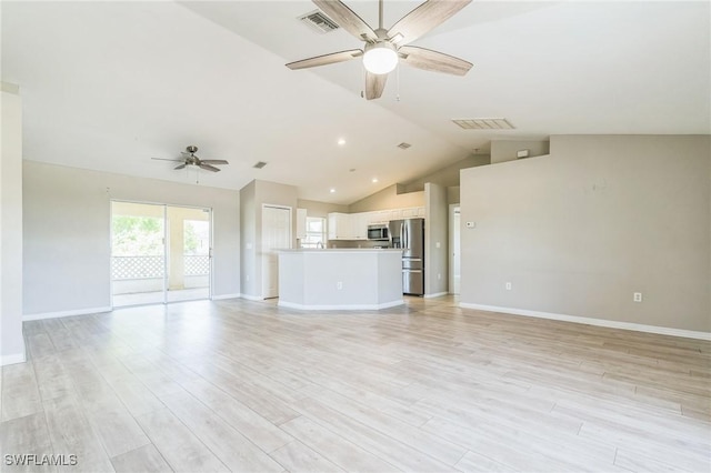 3406 27th St SW, Lehigh Acres, FL 33976 - unfurnished living room with a ceiling fan, baseboards, lofted ceiling, light wood-style floors, and recessed lighting
