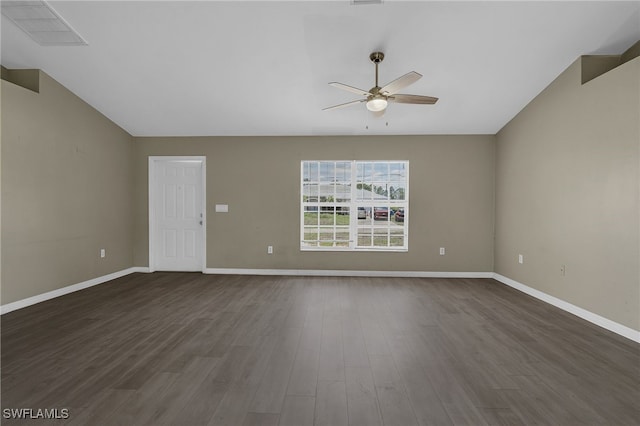 3406 27th St SW, Lehigh Acres, FL 33976 - unfurnished room with ceiling fan, vaulted ceiling, dark wood-style flooring, and baseboards