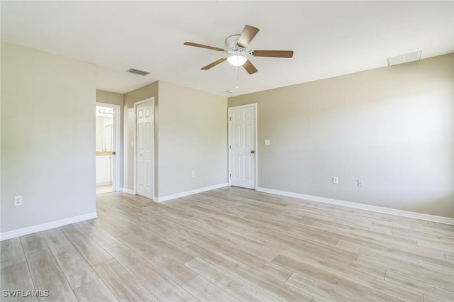 3406 27th St SW, Lehigh Acres, FL 33976 - spare room featuring a ceiling fan, light wood-style flooring, and baseboards