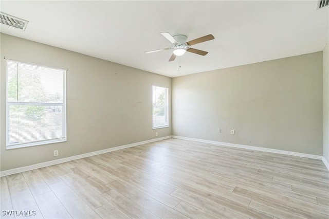 3406 27th St SW, Lehigh Acres, FL 33976 - empty room with ceiling fan, light wood finished floors, and baseboards