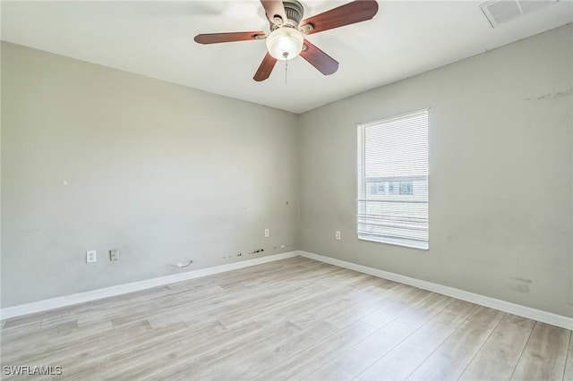 3406 27th St SW, Lehigh Acres, FL 33976 - empty room with light wood finished floors, baseboards, and a ceiling fan