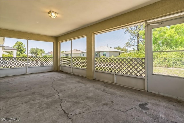 3406 27th St SW, Lehigh Acres, FL 33976 - unfurnished sunroom with plenty of natural light