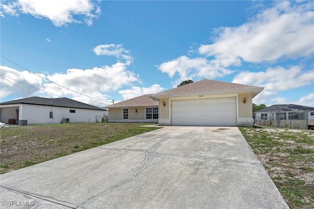 3406 27th St SW, Lehigh Acres, FL 33976 - single story home featuring driveway, stucco siding, and a garage