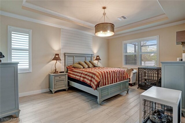 9292 Cayman Dr, Naples, FL 34114 - bedroom with a raised ceiling, light wood-type flooring, crown molding, and baseboards