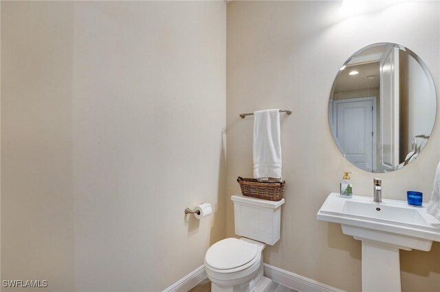 9292 Cayman Dr, Naples, FL 34114 - bathroom featuring toilet and baseboards