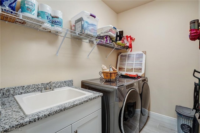 9292 Cayman Dr, Naples, FL 34114 - laundry room featuring independent washer and dryer, baseboards, and cabinet space