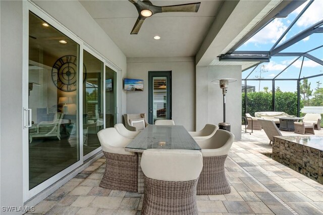 9292 Cayman Dr, Naples, FL 34114 - view of patio with outdoor dining area, ceiling fan, glass enclosure, and an outdoor hangout area