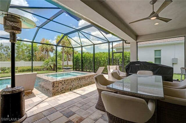 9292 Cayman Dr, Naples, FL 34114 - view of patio / terrace featuring an in-ground hot tub, a ceiling fan, and glass enclosure