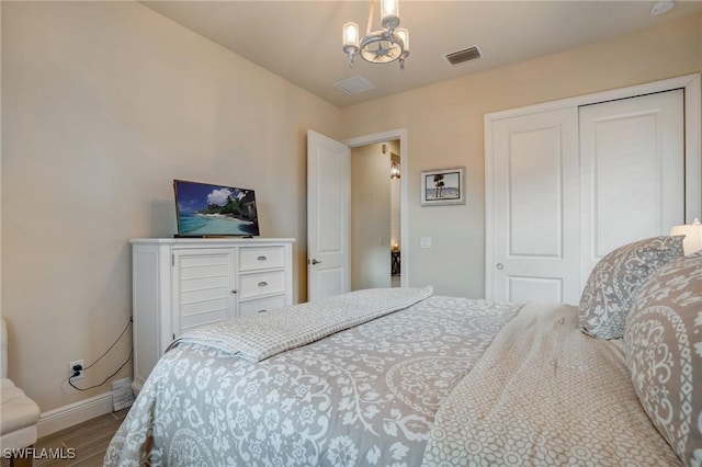 9292 Cayman Dr, Naples, FL 34114 - bedroom with baseboards, wood finished floors, and a closet