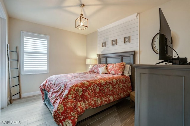 9292 Cayman Dr, Naples, FL 34114 - bedroom featuring wood finished floors and baseboards