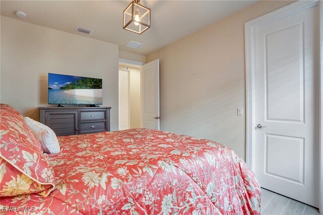9292 Cayman Dr, Naples, FL 34114 - bedroom with wood finished floors