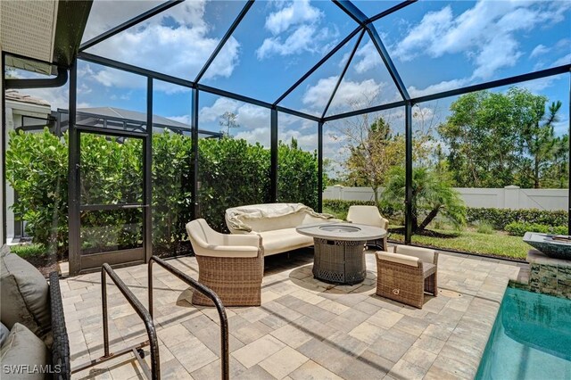 9292 Cayman Dr, Naples, FL 34114 - fenced backyard featuring a patio area, a lanai, and an outdoor living space with a fire pit