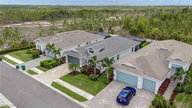 9292 Cayman Dr, Naples, FL 34114 - view from above of property featuring a heavily wooded area