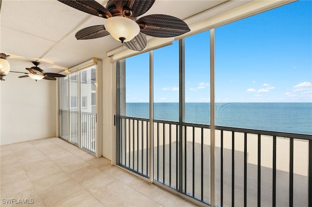 25900 Hickory Blvd Unit 504, Bonita Springs, FL 34134 - unfurnished sunroom with a water view and tile patterned floors