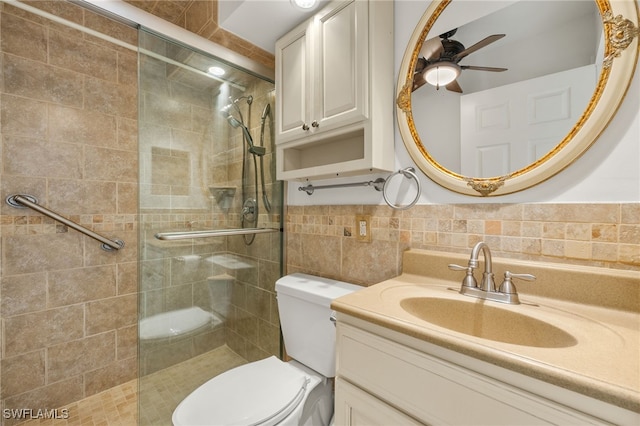 25900 Hickory Blvd Unit 504, Bonita Springs, FL 34134 - full bathroom with tile walls, a tile shower, toilet, vanity, and a ceiling fan