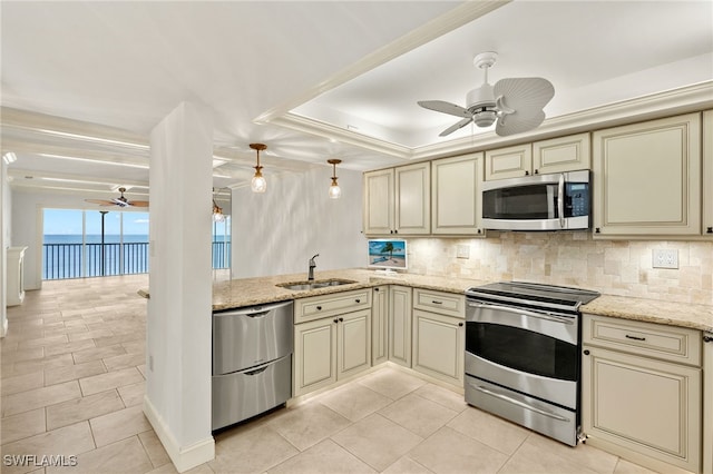 25900 Hickory Blvd Unit 504, Bonita Springs, FL 34134 - kitchen with cream cabinetry, appliances with stainless steel finishes, and ceiling fan
