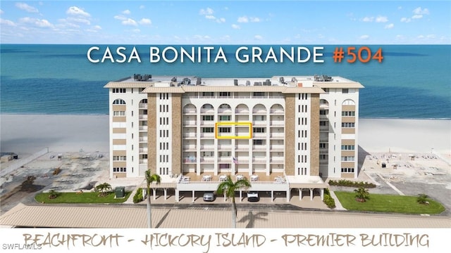 25900 Hickory Blvd Unit 504, Bonita Springs, FL 34134 - view of apartment building / complex with a water view and uncovered parking