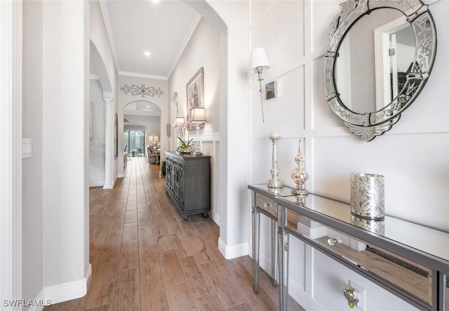 23268 Sanabria Loop, Bonita Springs, FL 34135 - corridor with arched walkways, crown molding, and wood finished floors