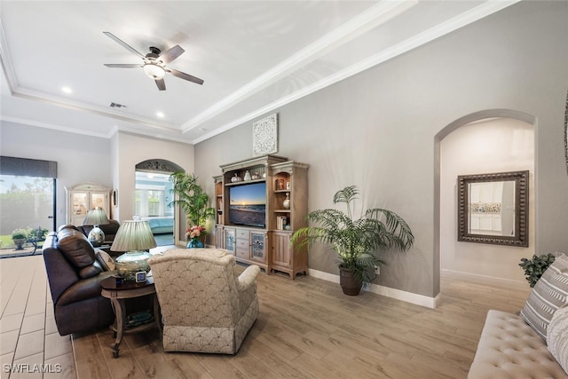 23268 Sanabria Loop, Bonita Springs, FL 34135 - living area with arched walkways, a raised ceiling, ceiling fan, light wood-type flooring, and recessed lighting