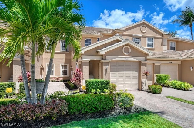 13891 Lake Mahogany Blvd Unit 3123, Fort Myers, FL 33907 - multi unit property with stucco siding, decorative driveway, and a tile roof