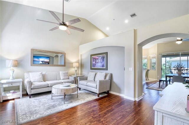 13891 Lake Mahogany Blvd Unit 3123, Fort Myers, FL 33907 - living room with a ceiling fan, arched walkways, dark wood-style floors, baseboards, and high vaulted ceiling