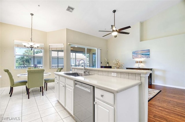 13891 Lake Mahogany Blvd Unit 3123, Fort Myers, FL 33907 - kitchen featuring dishwasher, a sink, baseboards, a ceiling fan, and a chandelier
