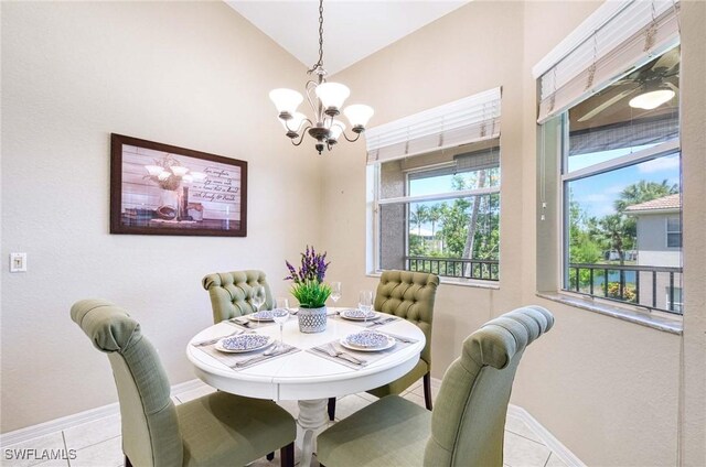 13891 Lake Mahogany Blvd Unit 3123, Fort Myers, FL 33907 - tiled dining space featuring a chandelier, baseboards, and lofted ceiling