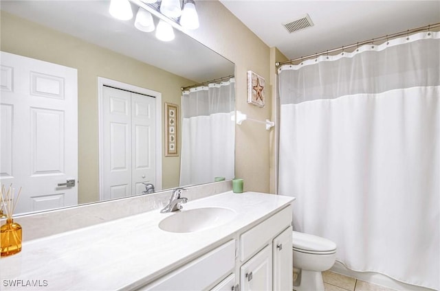 13891 Lake Mahogany Blvd Unit 3123, Fort Myers, FL 33907 - full bathroom featuring tile patterned flooring, vanity, toilet, and a shower with shower curtain
