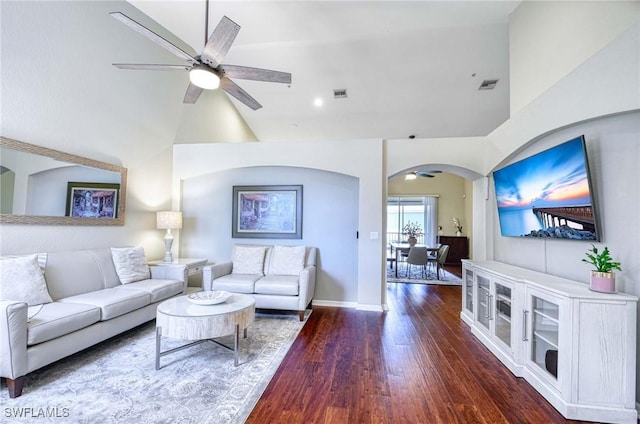 13891 Lake Mahogany Blvd Unit 3123, Fort Myers, FL 33907 - living room featuring a ceiling fan, arched walkways, high vaulted ceiling, dark wood-style flooring, and baseboards