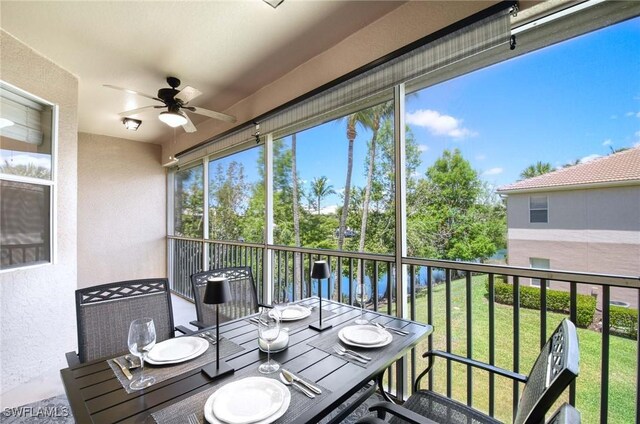 13891 Lake Mahogany Blvd Unit 3123, Fort Myers, FL 33907 - sunroom featuring a ceiling fan and outdoor dining area