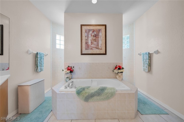 2010 SE 13th Ter, Cape Coral, FL 33990 - full bath with a bath, vanity, and tile patterned flooring