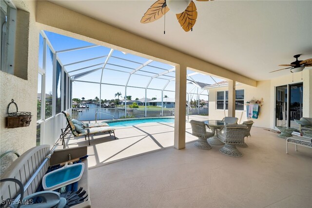 2010 SE 13th Ter, Cape Coral, FL 33990 - view of pool with ceiling fan, a patio area, and glass enclosure