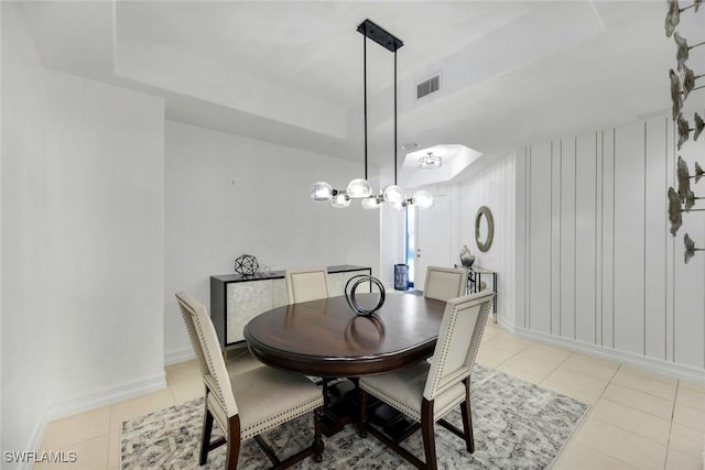 10220 Bellavista Cir Unit 1402, Miromar Lakes, FL 33913 - dining area with light tile patterned floors, baseboards, and a tray ceiling