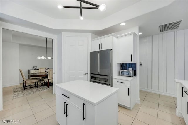 10220 Bellavista Cir Unit 1402, Miromar Lakes, FL 33913 - kitchen with freestanding refrigerator, light tile patterned flooring, light countertops, a decorative wall, and recessed lighting