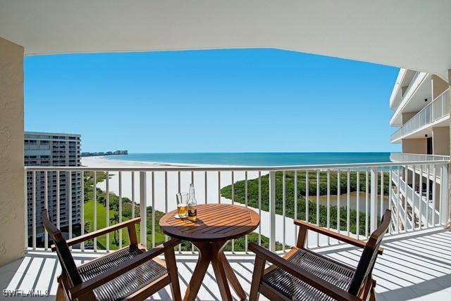 380 Seaview Ct Unit 1704, Marco Island, FL 34145 - balcony featuring view of water and beach