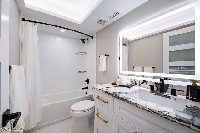 380 Seaview Ct Unit 1704, Marco Island, FL 34145 - full bathroom featuring toilet, shower / bath combo, vanity, tile patterned floors, and recessed lighting